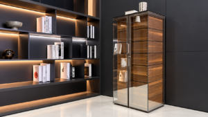 Tall aluminium glass display cabinet in a modern living room with wood drawers